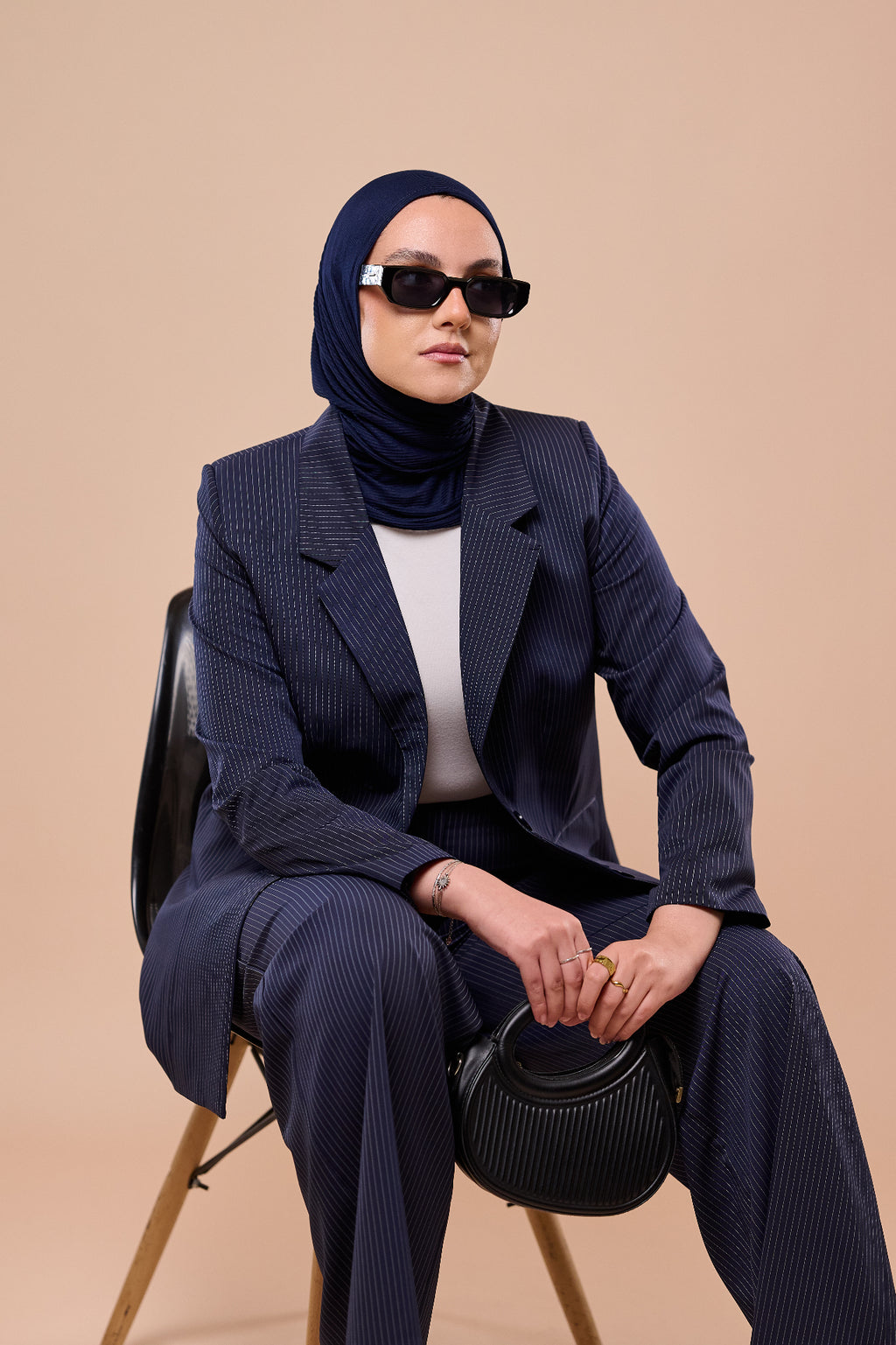 Pinstripe Suit in Navy - seated pose