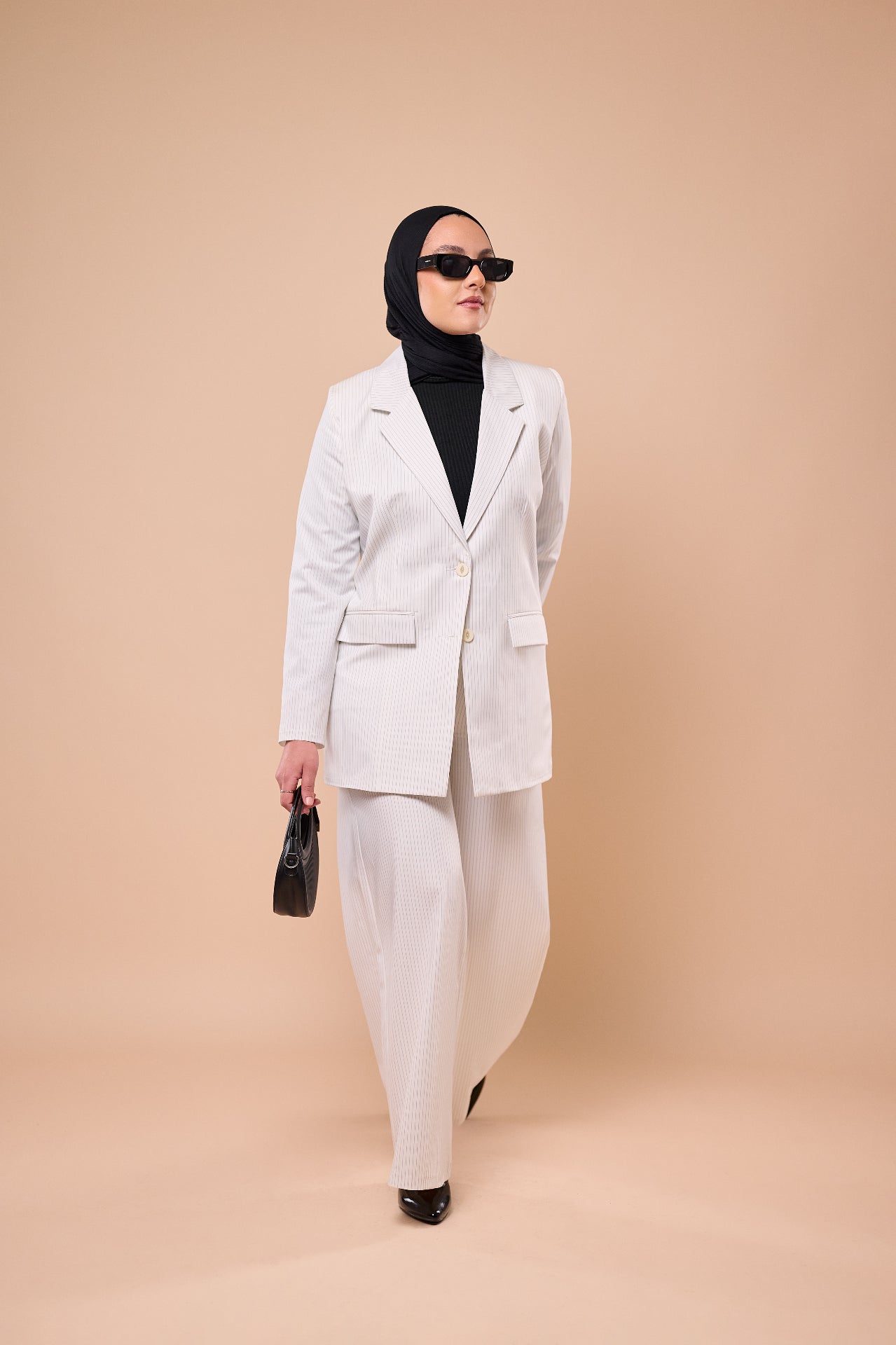 Pinstripe Suit in White - walking pose